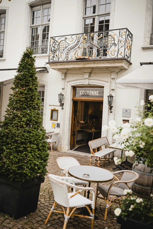 a building with tables and chairs in front of it