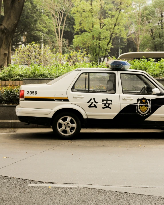 a police car parked in front of a building