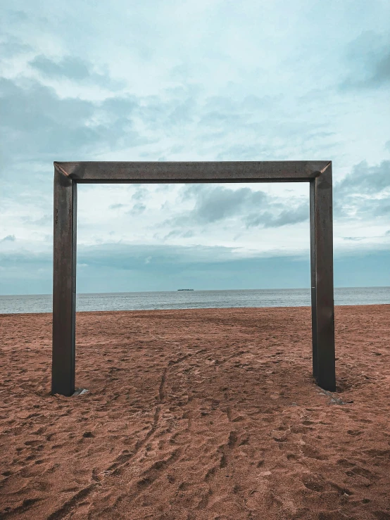 an image of a frame in the sand