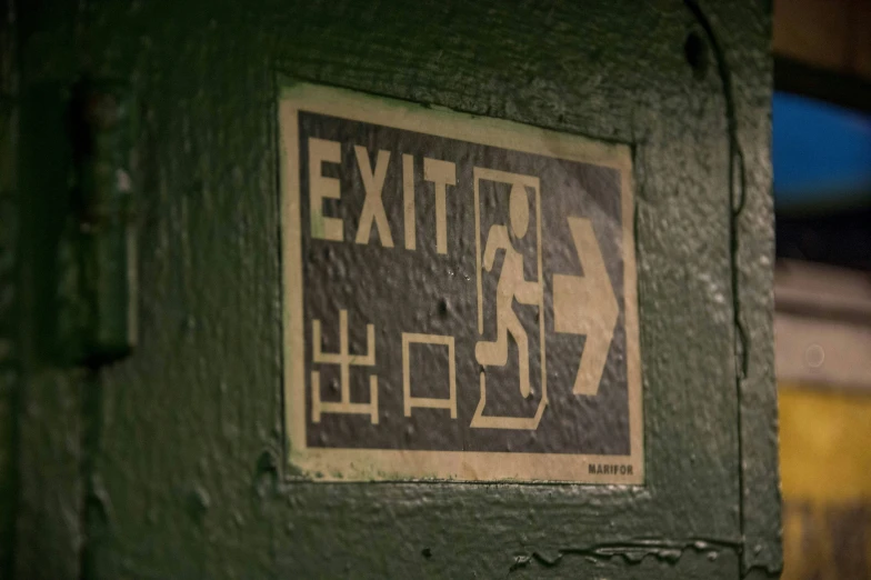 this picture is very dark and shows the exit sign