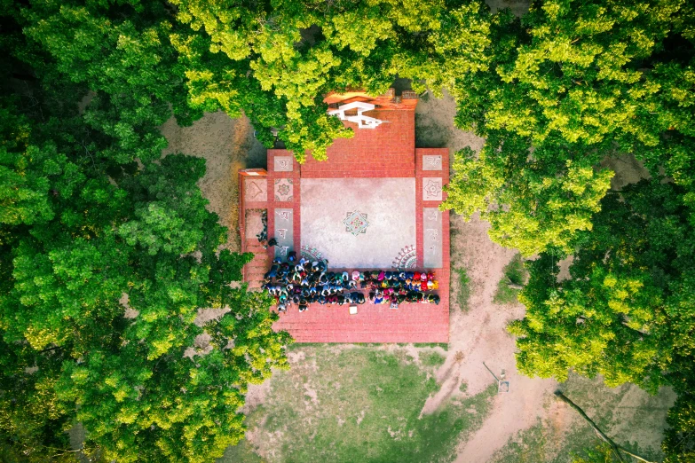 aerial view of group of people sitting at a place in park