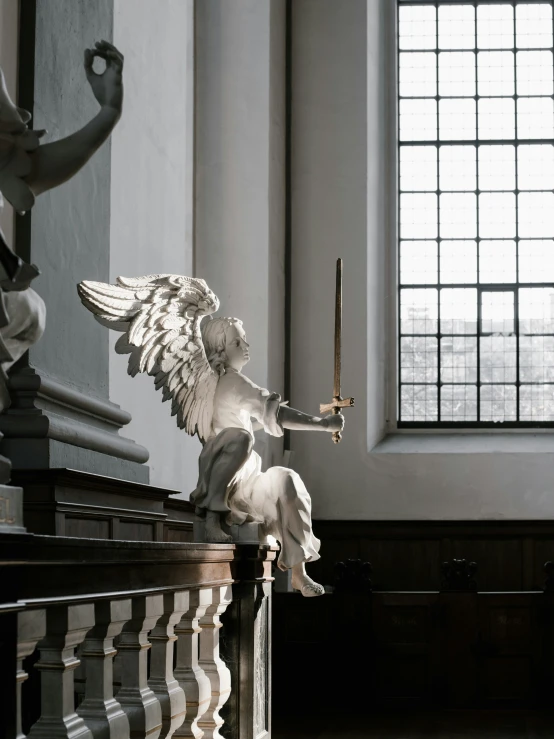 a statue of an angel holding a sword