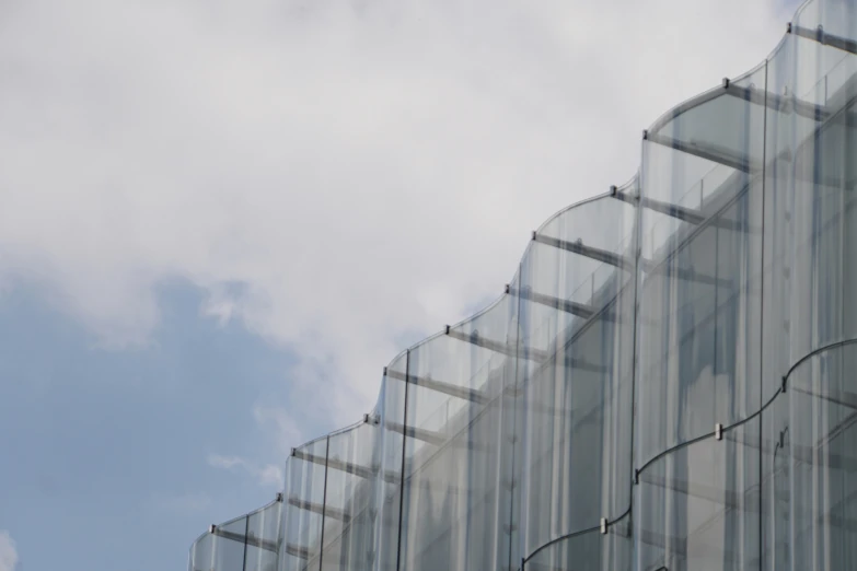 an object is reflected in the glass of a building