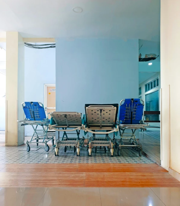 several chairs and an umbrella are in a blue room