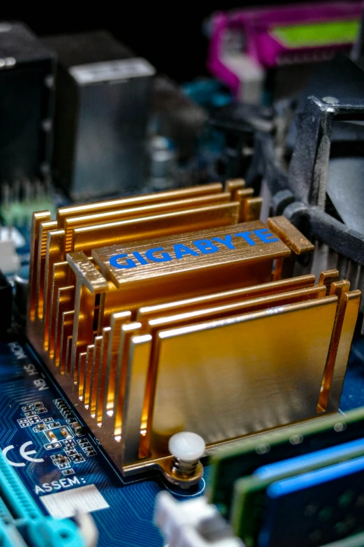 a small group of gold electronic components on a board