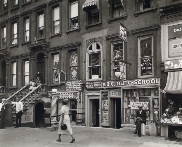 the old po shows a man walking past a bunch of shops