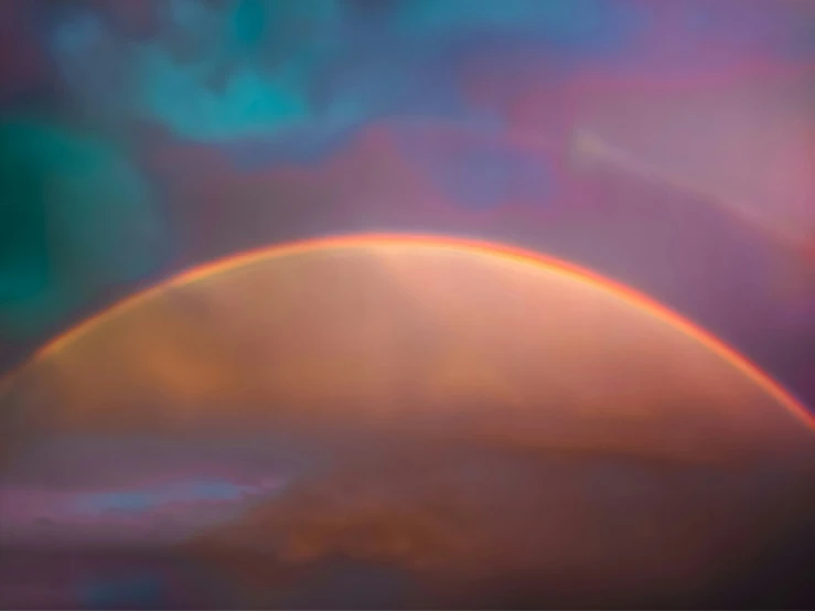 a painting of a rainbow in the sky