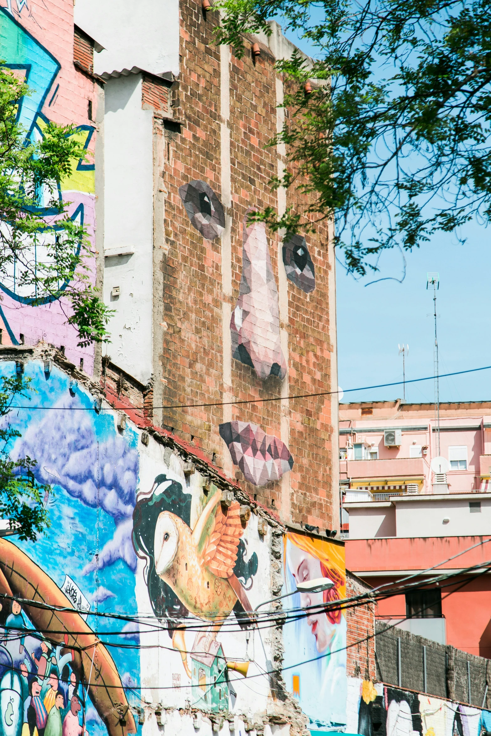 a mural on a brick building in a city