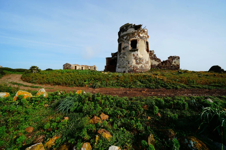 an old tower sitting on top of a hill