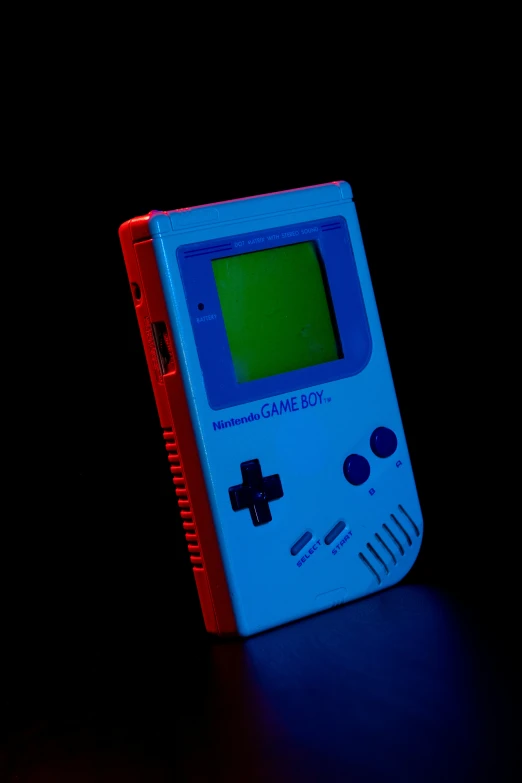 a light blue, portable gameboy is shown with a red box