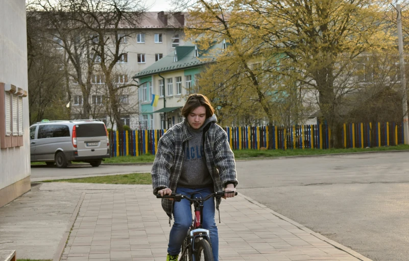 a person is riding a bike on the side of a road