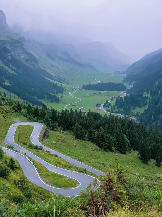 a mountain road in the middle of a scenic region