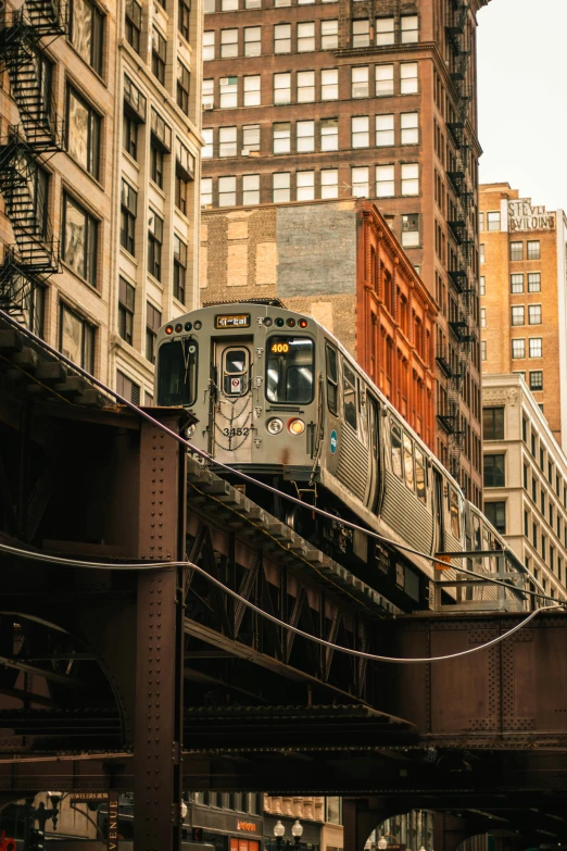 a city train is traveling on the elevated tracks