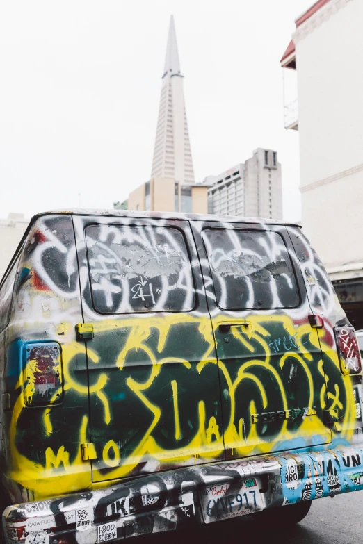 graffiti has been spray painted on the side of the van