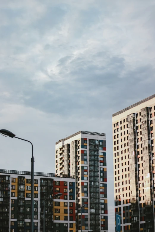 buildings on an overcast day with a blue sky in the background