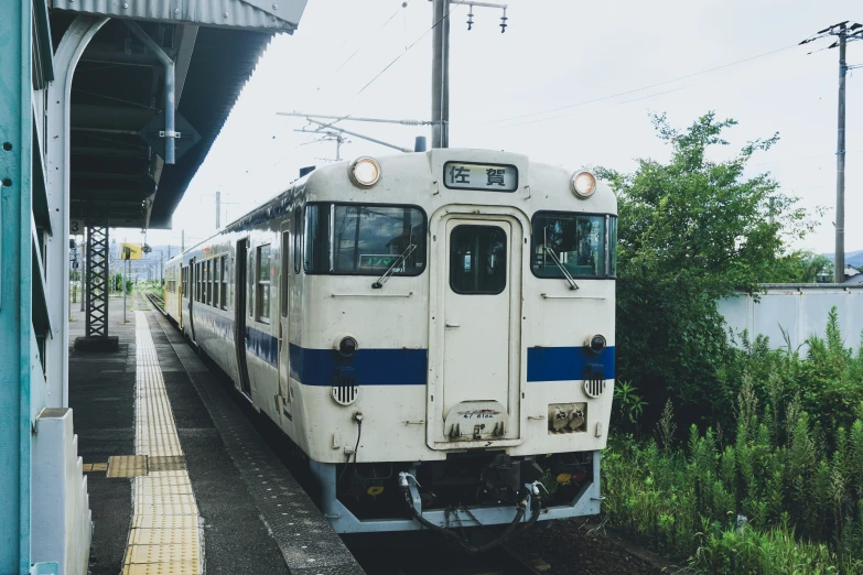 a train pulls into a station where the passenger is waiting