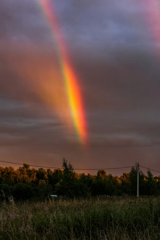 a couple of rainbows are lit by the sunlight