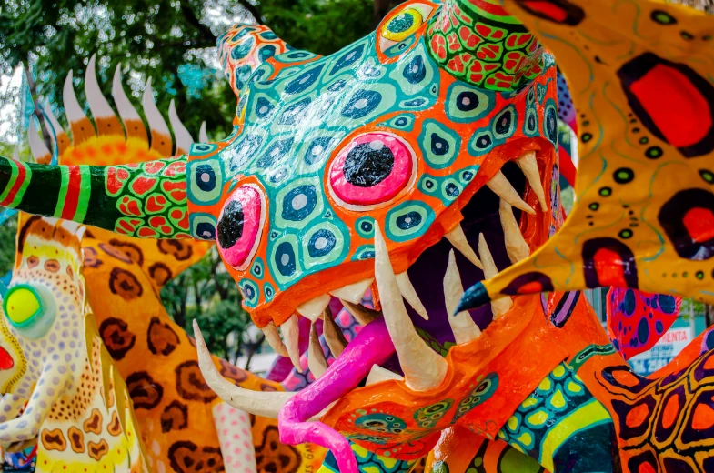 brightly colored statues with the word dragon above them