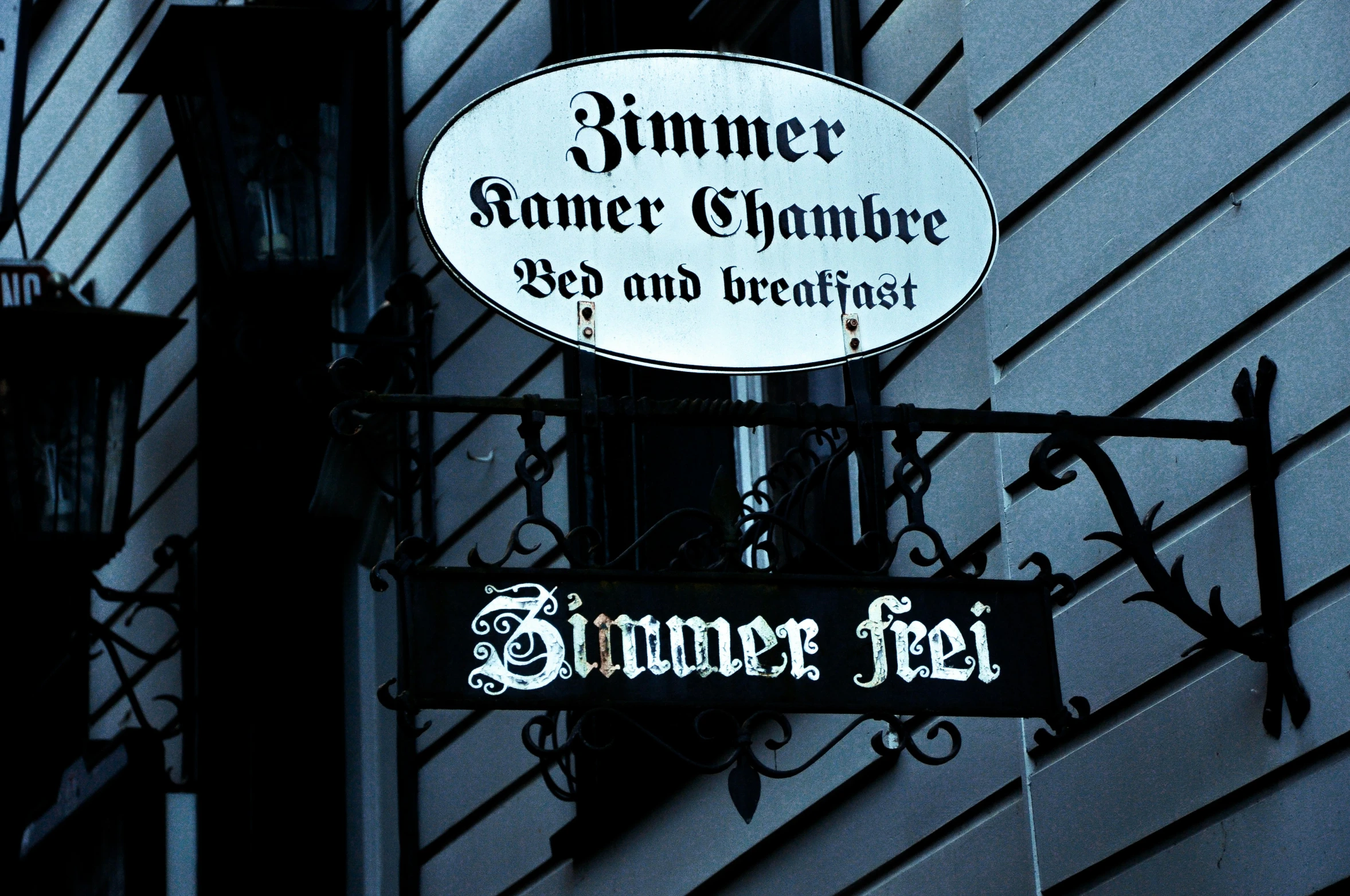 a sign for dinner, wine and cheese next to a building