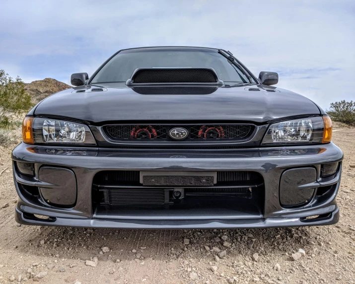 a sports car is seen parked in the desert