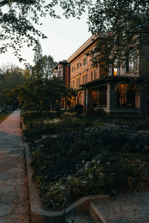 a large house is seen from the side in the evening