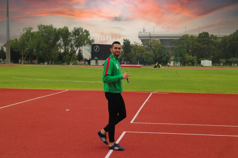 a man standing on top of a tennis court