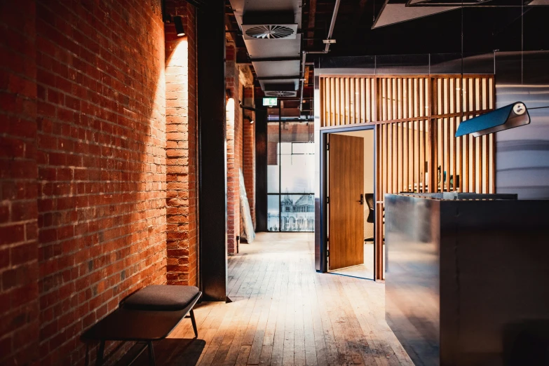 an open room with wooden floors and sliding doors