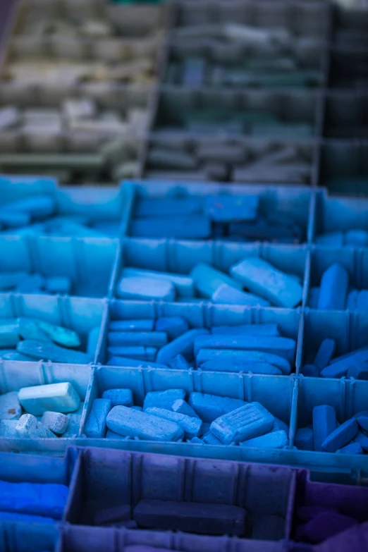 a box filled with lots of different types of blue cake