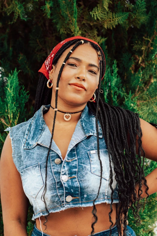 a girl with dreadlocks looking up and to the side