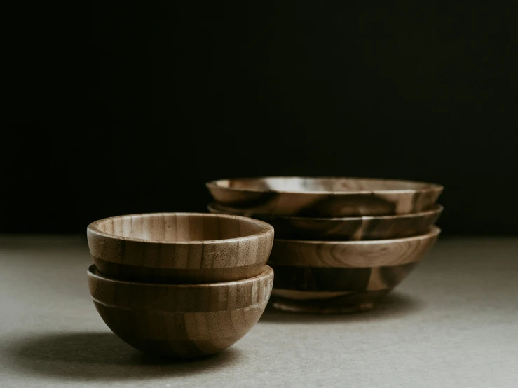 small wooden bowls sitting on top of a table