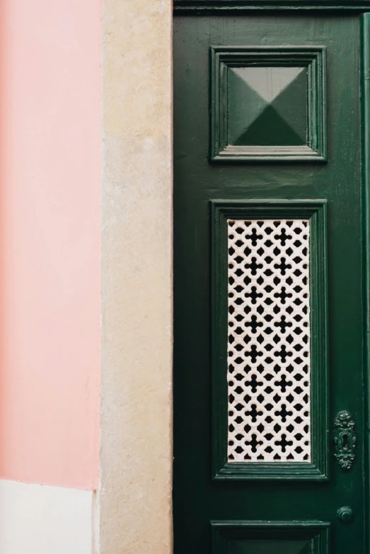 a green door has white and black geometric designs