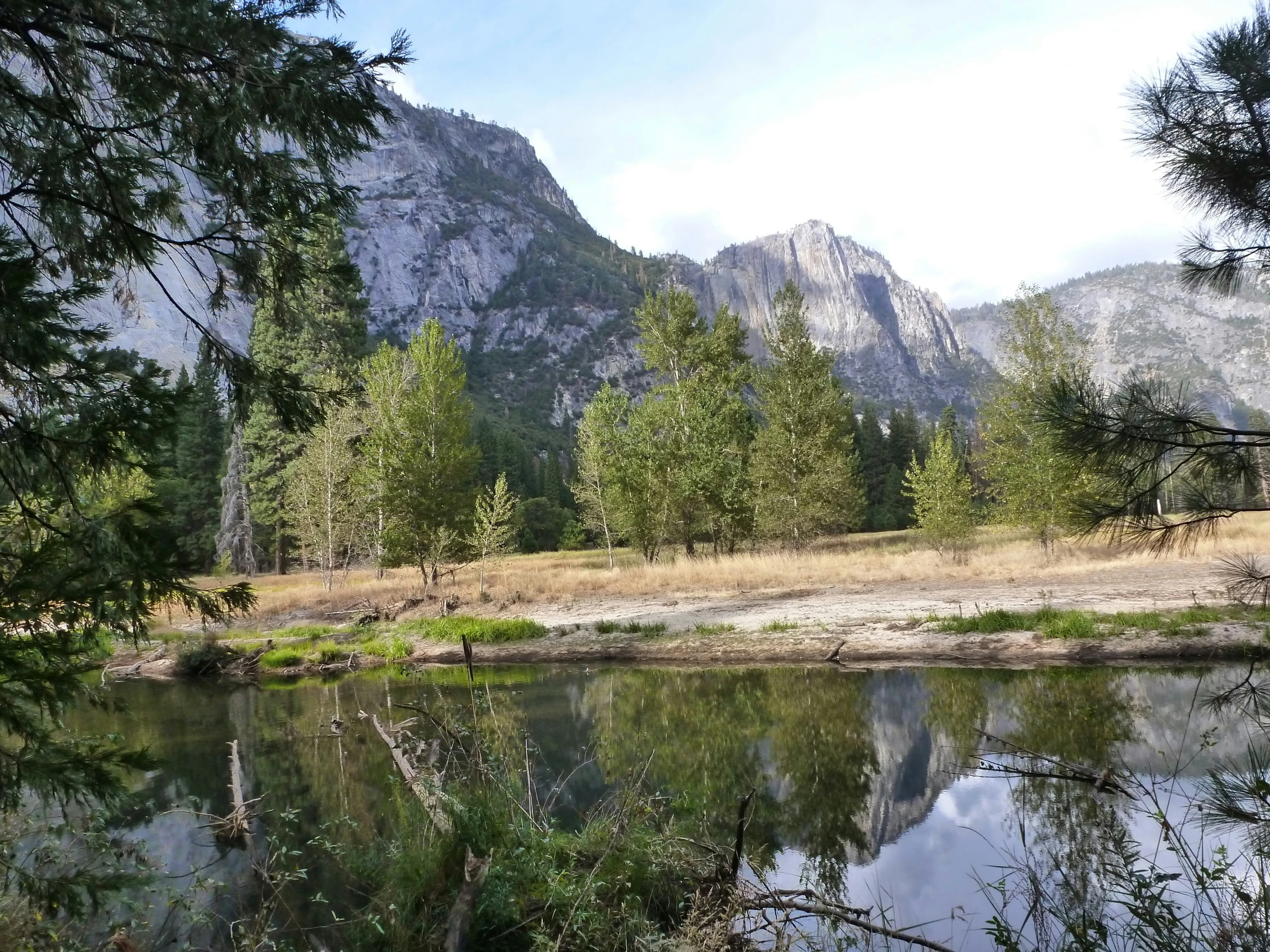 a lake and mountain range in the background