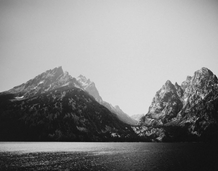 a view of some mountains and a body of water