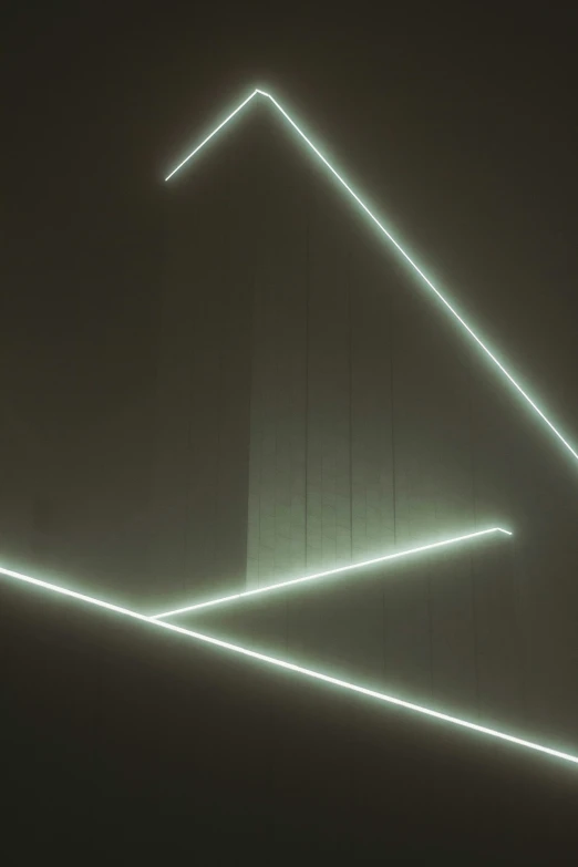 the room has two walls with three lines of light coming out