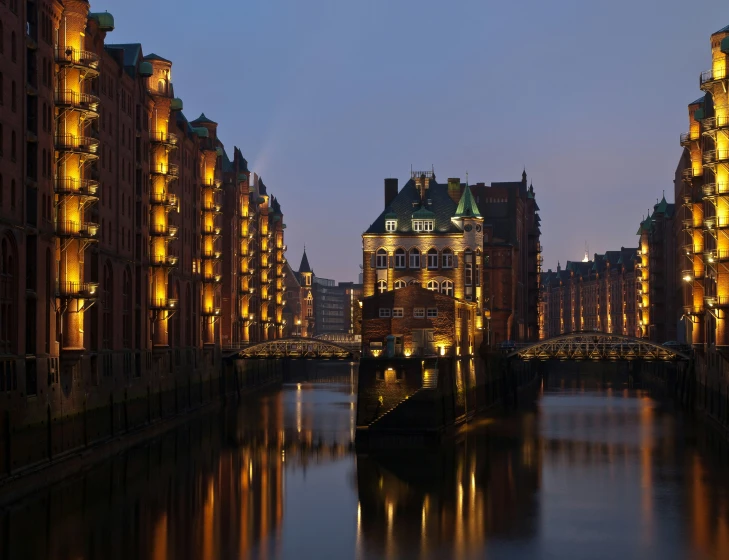 the river runs through the city at night