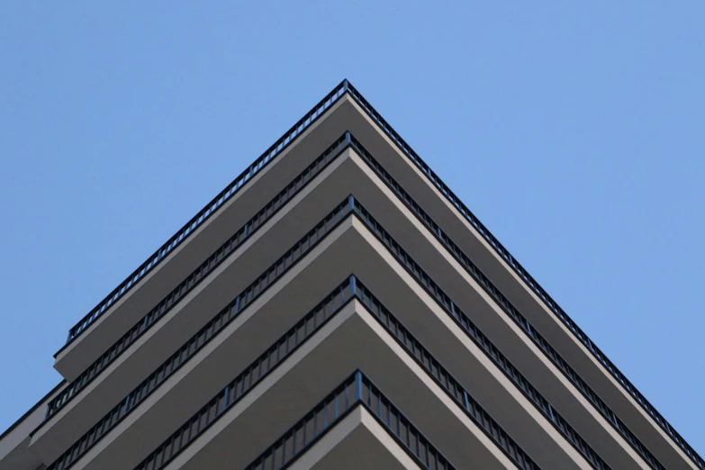 a clock on the top of an upward building