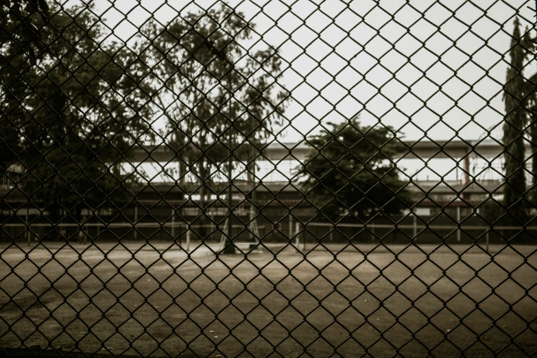 this is an image of a fence that looks over the park