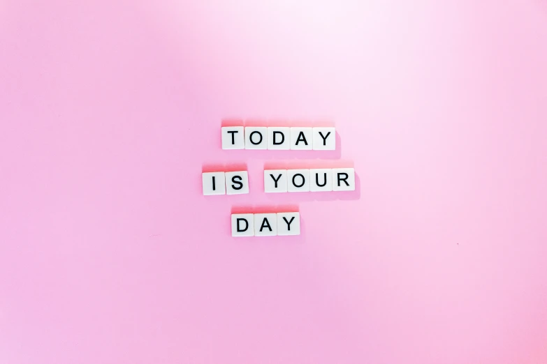 two scrabbles spell out words that says today is your day