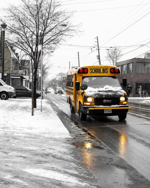 an bus traveling down a snow covered street