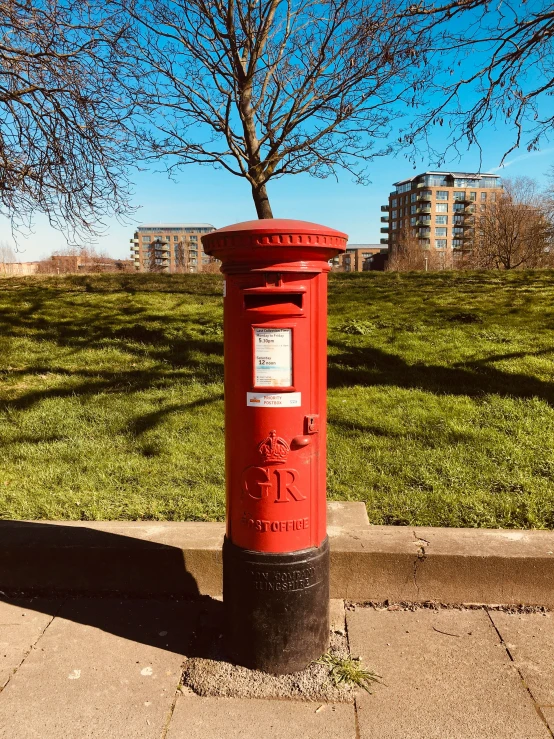 a large red post with an empty box at the top of it
