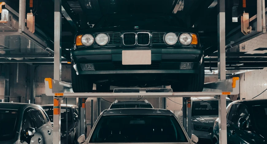 a group of cars parked inside of a garage