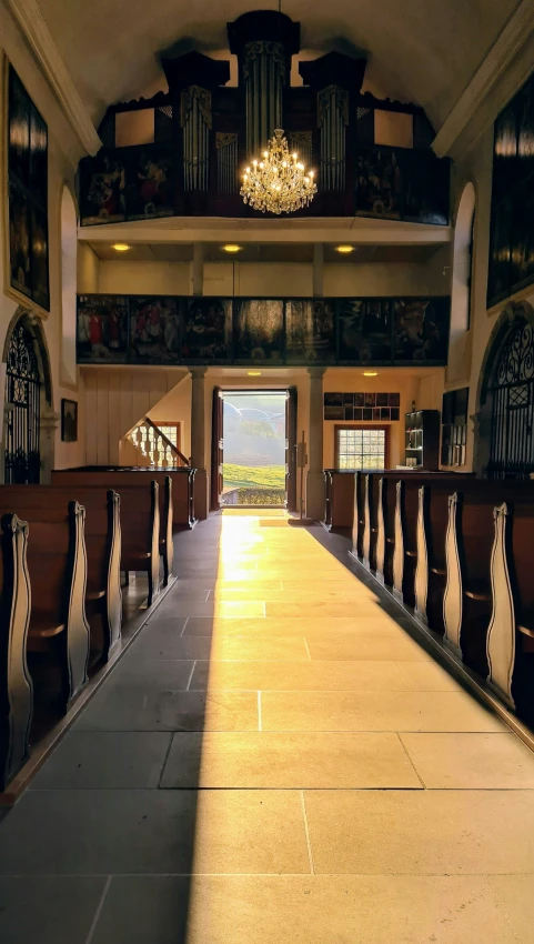 empty pews and tables in an ornate, historic church