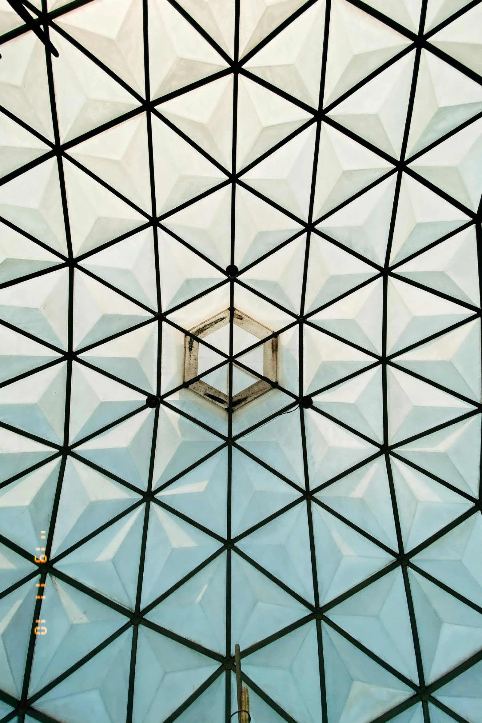 the roof of an outside structure has lines cut through it