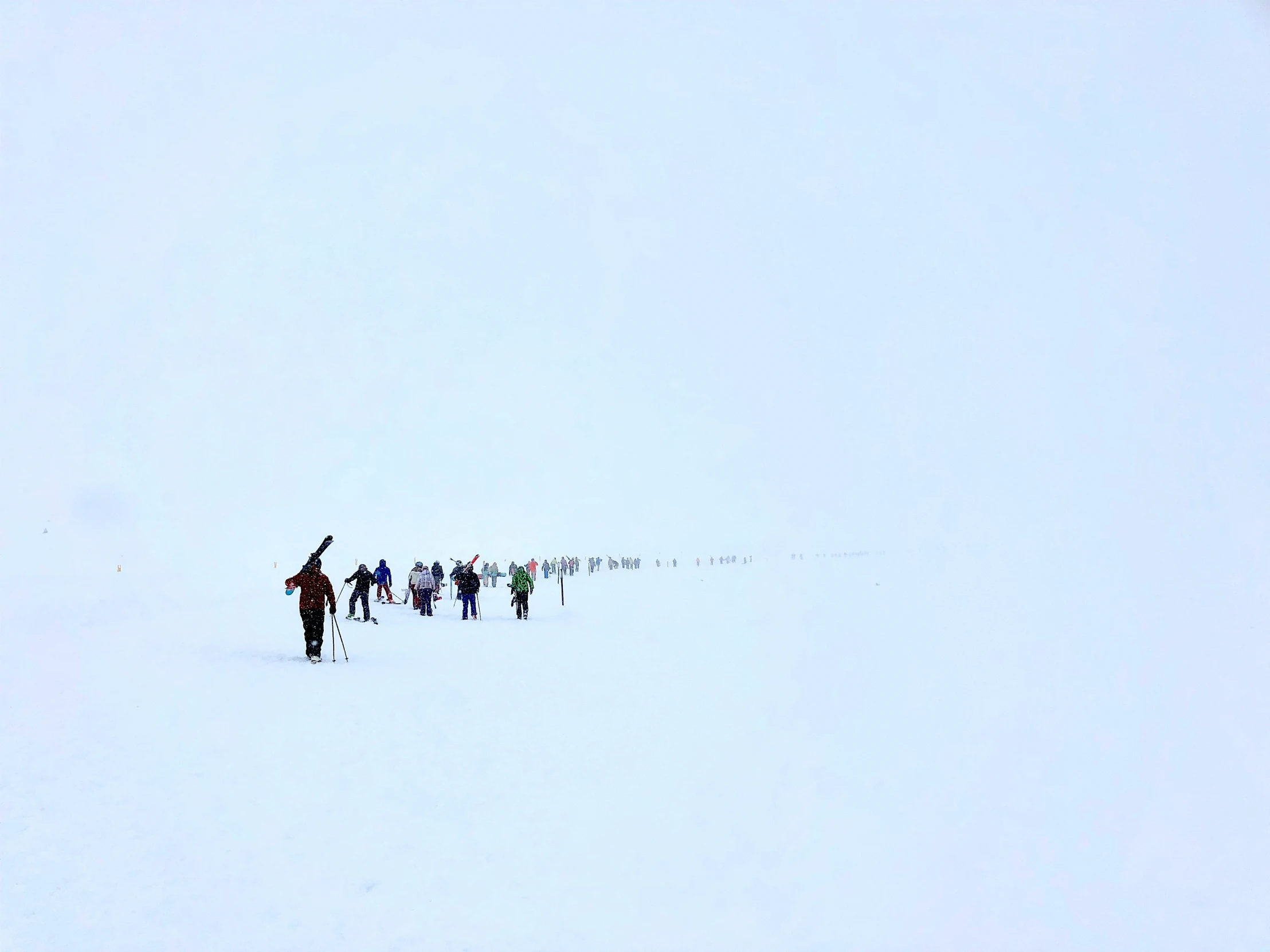 some people are in the snow with one of them on skis