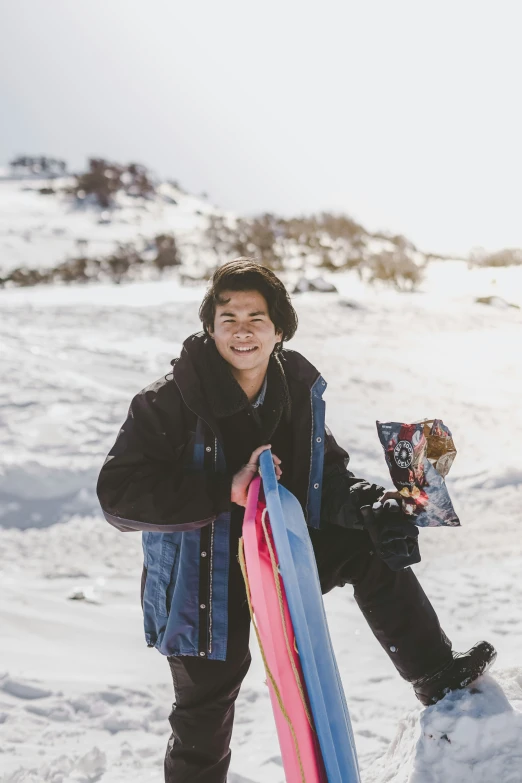 a person with some skis standing in the snow