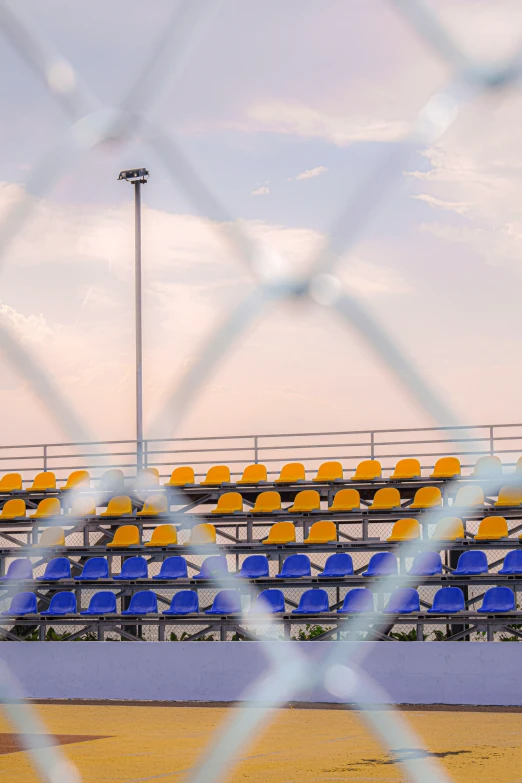 a stadium full of seats and poles next to the beach