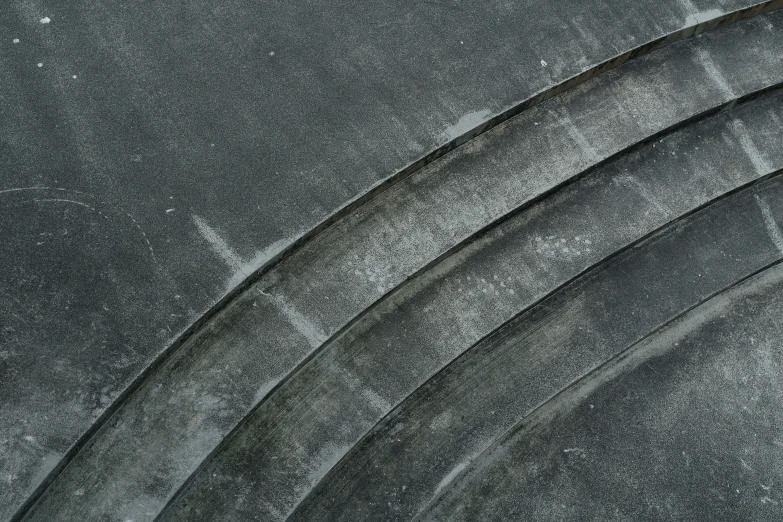 a group of five cement circles sit on top of each other