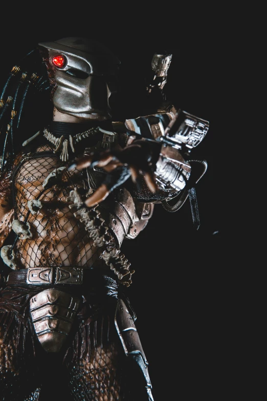 an image of predator costume on dark