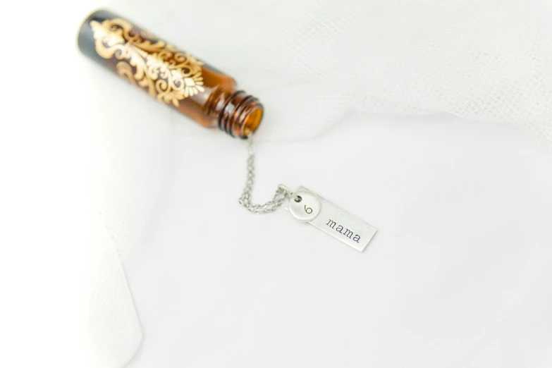a pen necklace with a personal tag