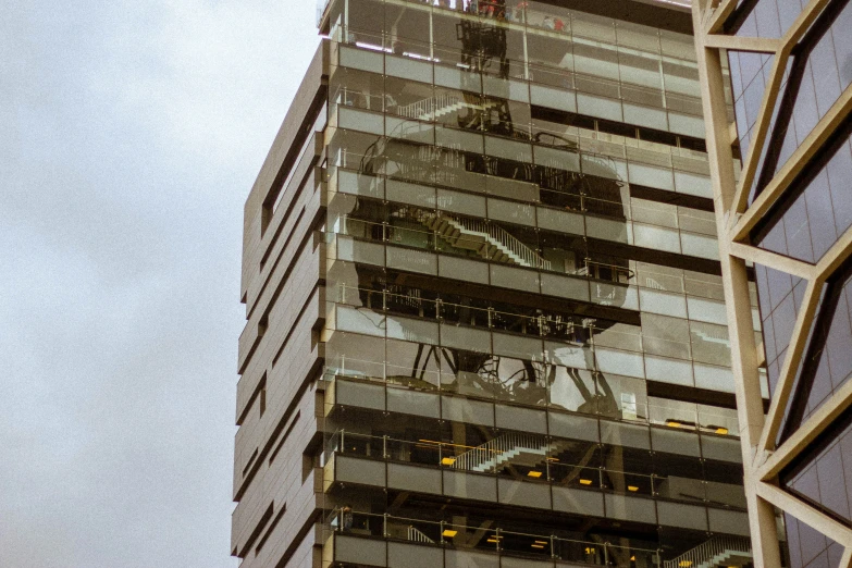 the reflection of a building in its mirrored glass facade